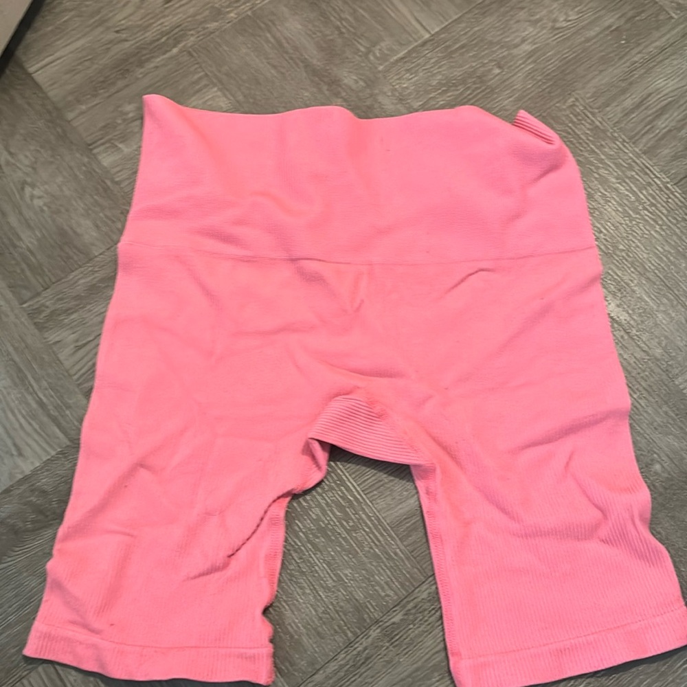 neonish pink athletic shorts. Not really sure what size the tag is ripped off